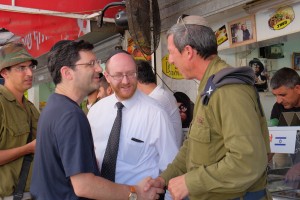Rabbi Weil, senior managing director of the OU, shaking hands with Rabbi Rafi Peretz, chief rabbi of the IDF, in Sderot. Photos by Abba Richman, unless indicated otherwise. 