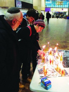 Students at Guelph University in Ontario lighting Chanukah candles on campus. Photo courtesy of JLIC educator Rabbi Daniel Levitt