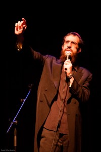 Mendy Pellin, a Lubavitch chasid, hosts a mock news program a la Jon Stewart’s The Daily Show on the Comedy Central cable network. Photo courtesy of Mendy Pellin