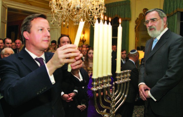 Chief Rabbi Lord Jonathan Sacks joining Prime Minister Cameron for the lighting of the Chanukah lights in Downing Street. Photo: Nicola Hammer