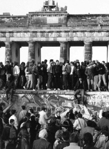 Germans from East and West standing on the Berlin Wall in front of the Brandenburg Gate, one day after the wall fell. Photo: AP Images