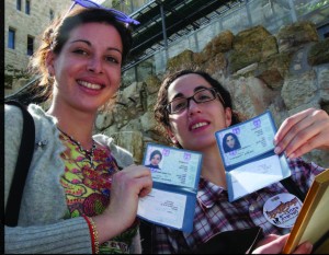 Two French olim proudly showing their new Israeli ID cards. Photos courtesy of the Jewish Agency for Israel