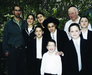 Rav Lichtenstein outside his home in Yerushalayim with some of his children and grandchildren. Courtesy of Yechiel Lichtenstein