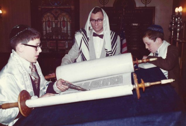 Thirteen-year-old Rashi practices reading from the Torah in preparation for his Bar Mitzvah, October 1974. From left: Rashi, his father, Edward Simon and his brother Hillel, age nine. Courtesy of Rabbi Rashi Simon